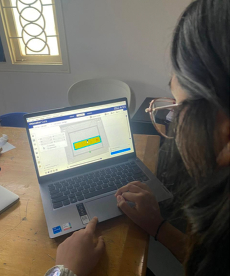 Student using laptop with accessibility challenges